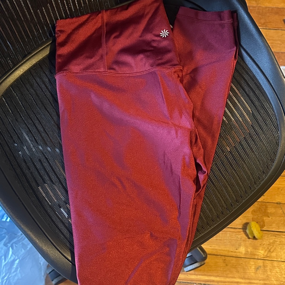 Athleta like new Elation shine tight leggings, size medium tall.